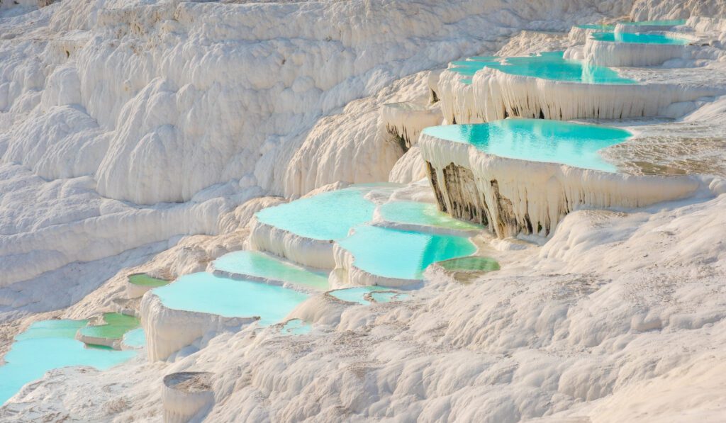 Discover the ethereal beauty of Pamukkale's natural pools with their mesmerizing blue waters. Experience the magic of this unique natural wonder in Turkey. 10 Best Places to Visit in Turkey