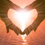 honeymoon turkey tours.Two hands in the shape of a heart on a sunset background over the sea. The concept of a romantic date, a declaration of love, a love relationship.