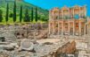 Ancient Splendor: Ephesus Ruins Gracefully Perched on a Sunlit Hillside.