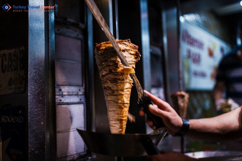 Savoring Authentic Flavors: Masterfully Cutting Doner Meat in Istanbul.