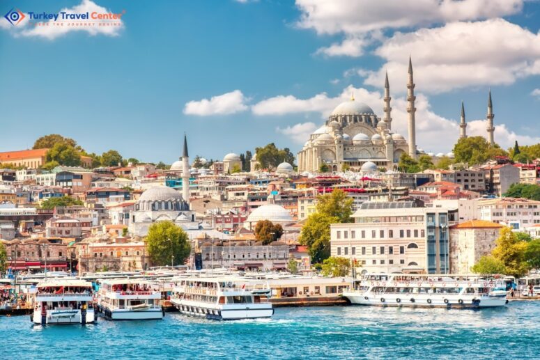 Touristic boats on Golden Horn bay with Suleymaniye Mosque in Istanbul, Turkey on a sunny summer day.